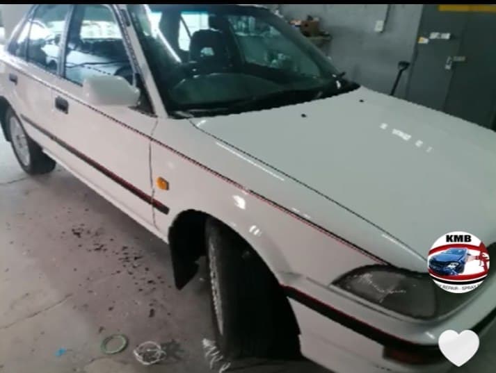 White Toyota Corolla refinished in the workshop