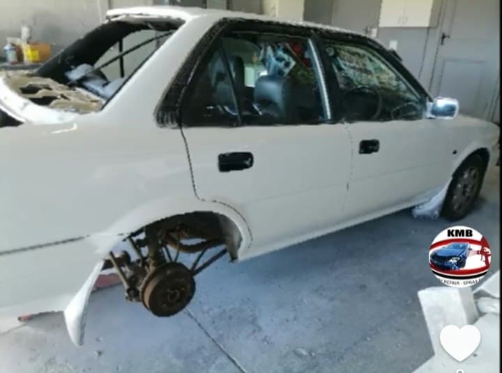 White Toyota Corolla during panel and body repair